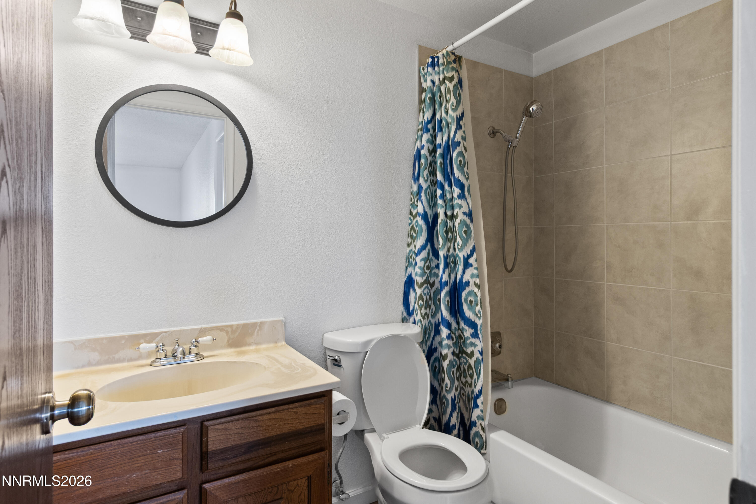 3142 Jarbidge Way Sparks, NV 89434 - Photo 32 of 42 a bathroom with a sink a toilet and a bathtub