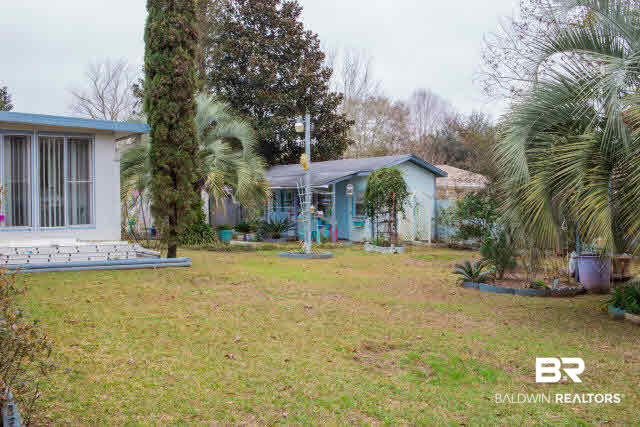 1504 North Cedar Street Foley, AL 36535 - Photo 13 of 16 Side view of back yard showing workshop.