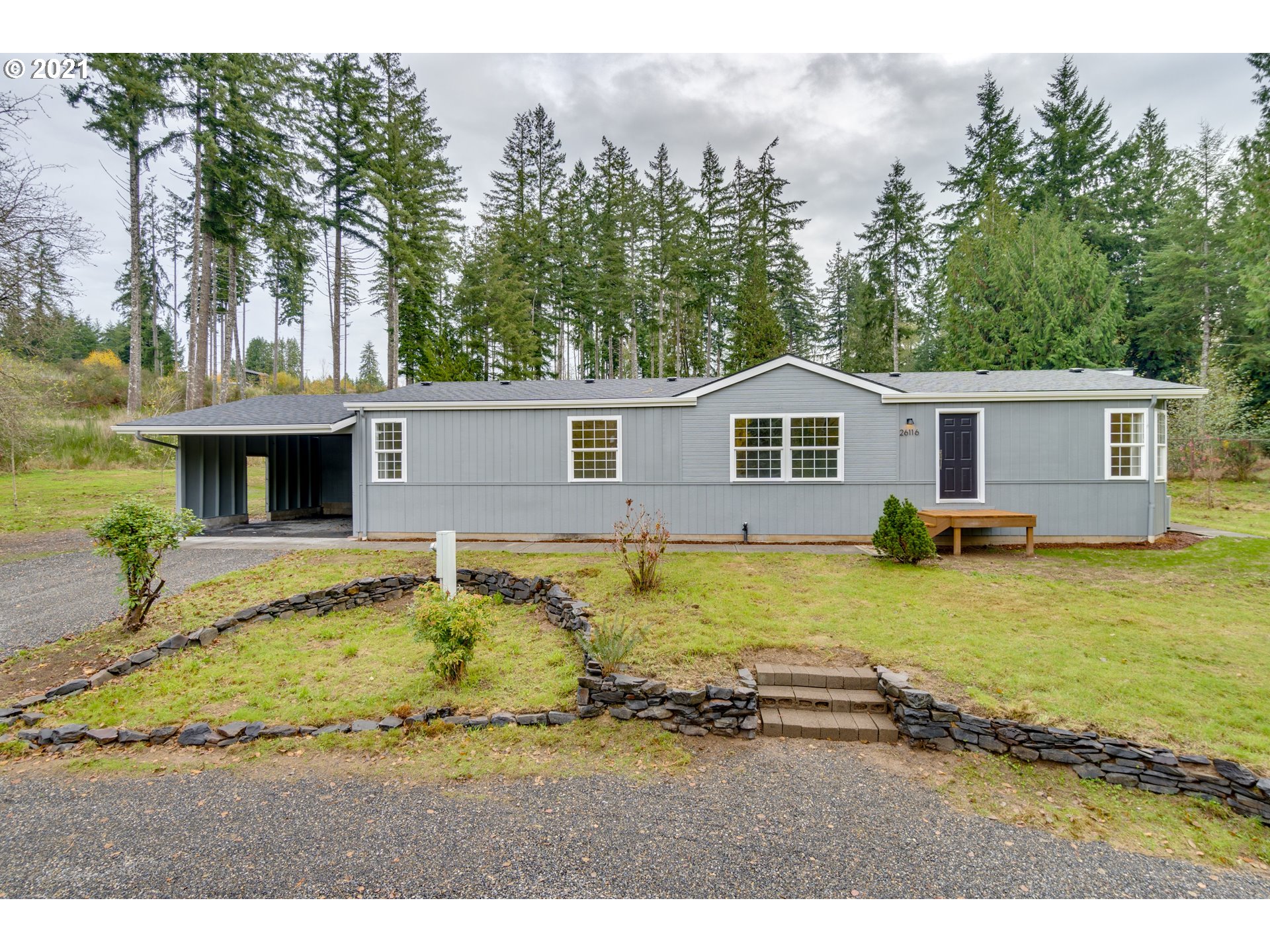 26116 Pellham Hill Road Rainier, OR 97048 - Photo 1 of 32 a view of a house with a swimming pool