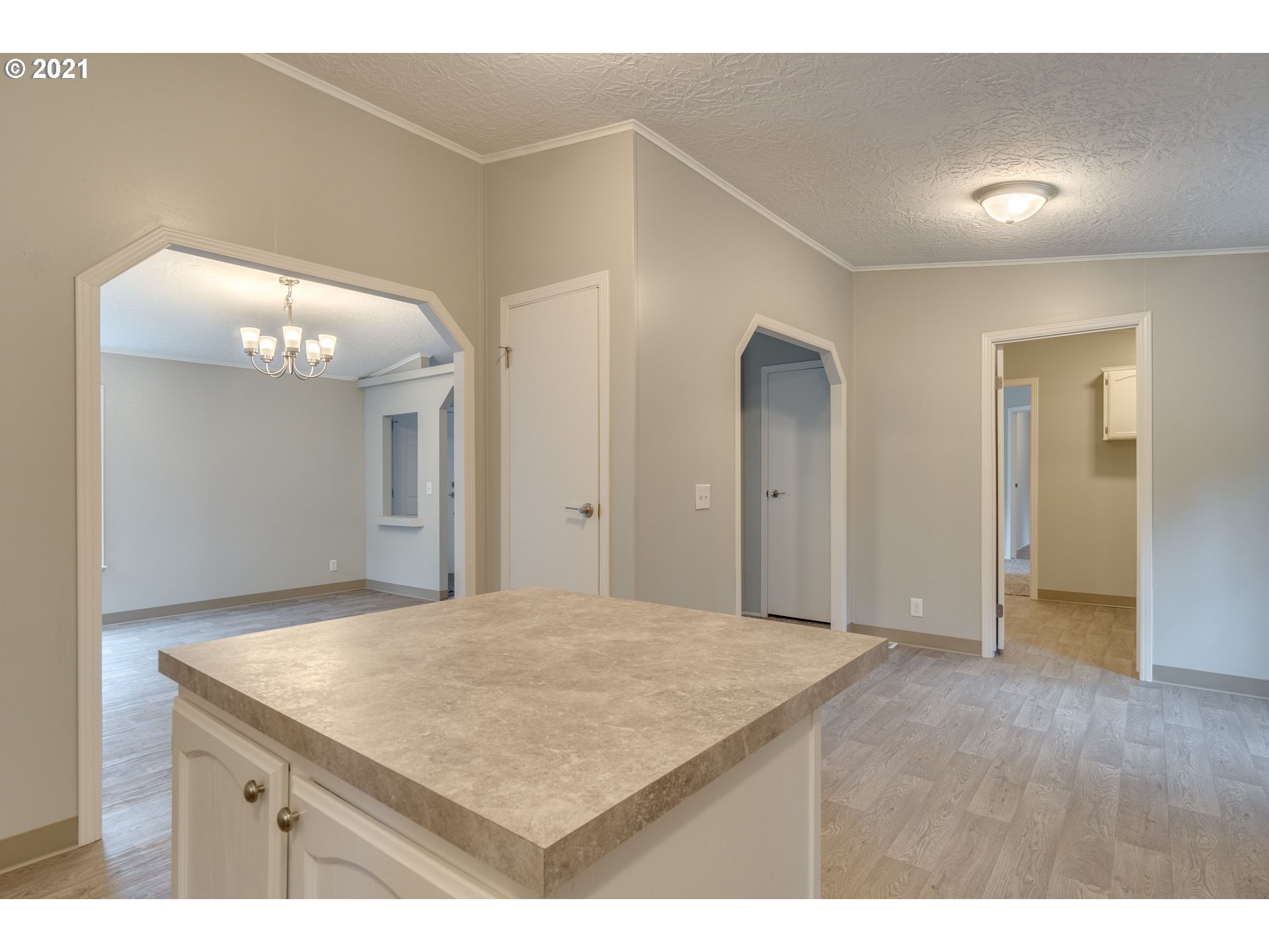 26116 Pellham Hill Road Rainier, OR 97048 - Photo 11 of 32 a view of kitchen and hallway with wooden floor
