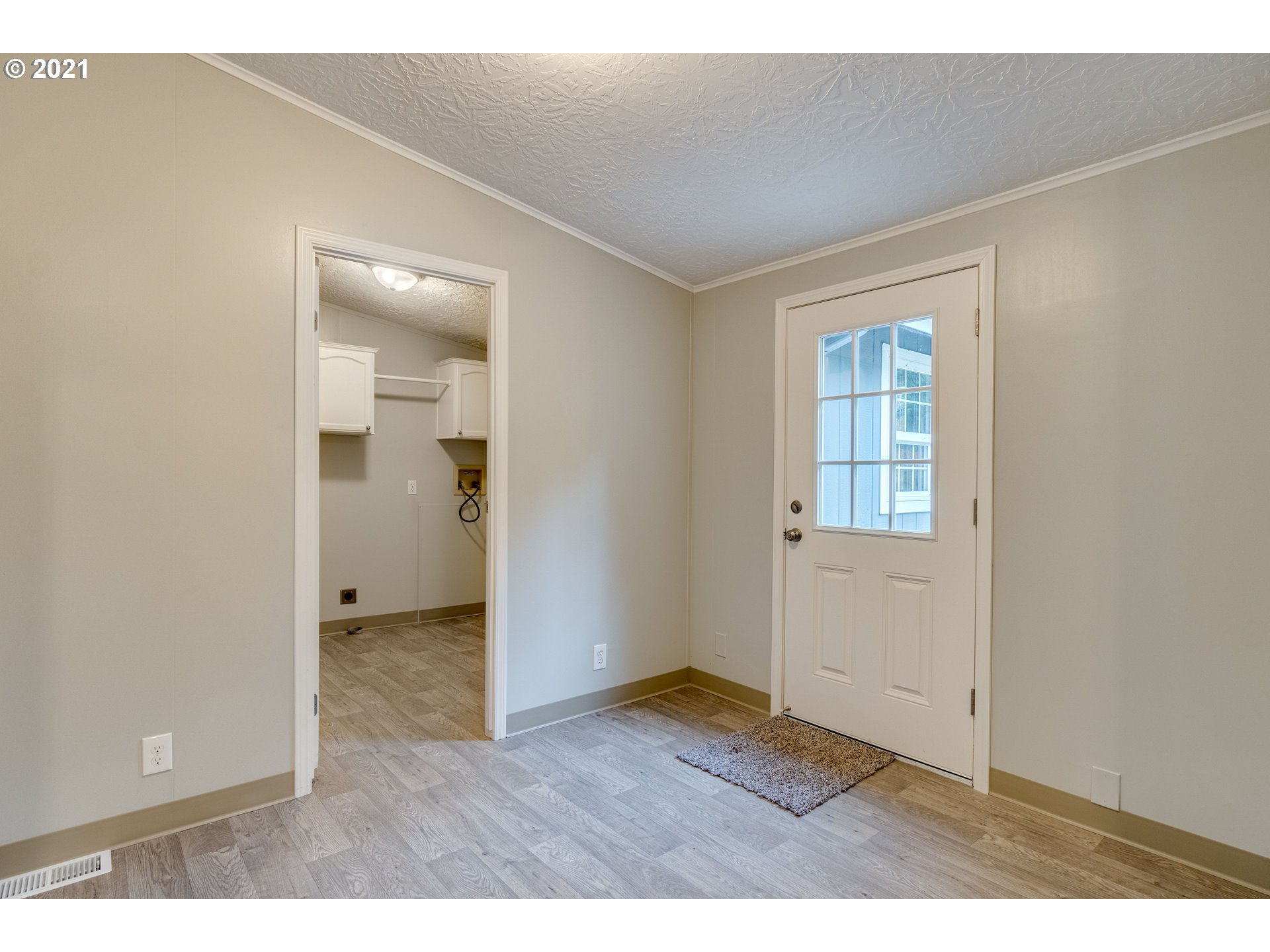 26116 Pellham Hill Road Rainier, OR 97048 - Photo 12 of 32 an empty room with wooden floor and windows