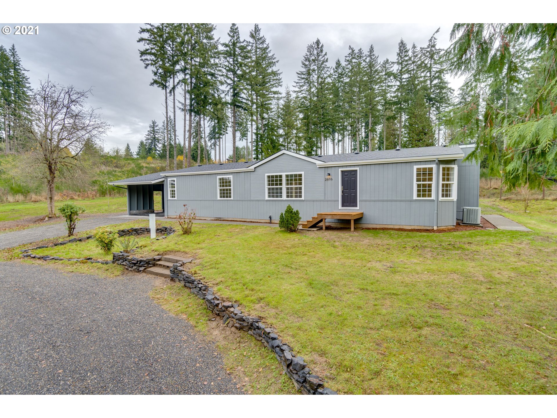 26116 Pellham Hill Road Rainier, OR 97048 - Photo 2 of 32 a front view of house with yard and trees around