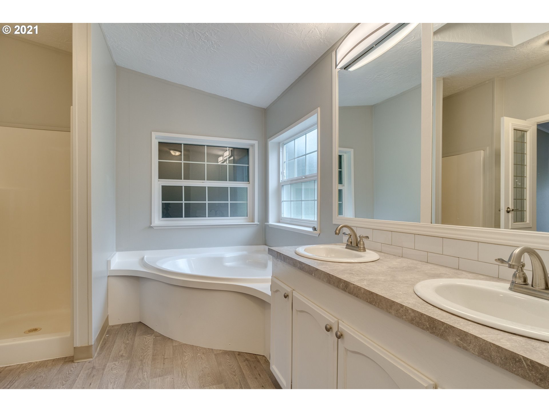 26116 Pellham Hill Road Rainier, OR 97048 - Photo 21 of 32 a bathroom with a sink double vanity and a mirror