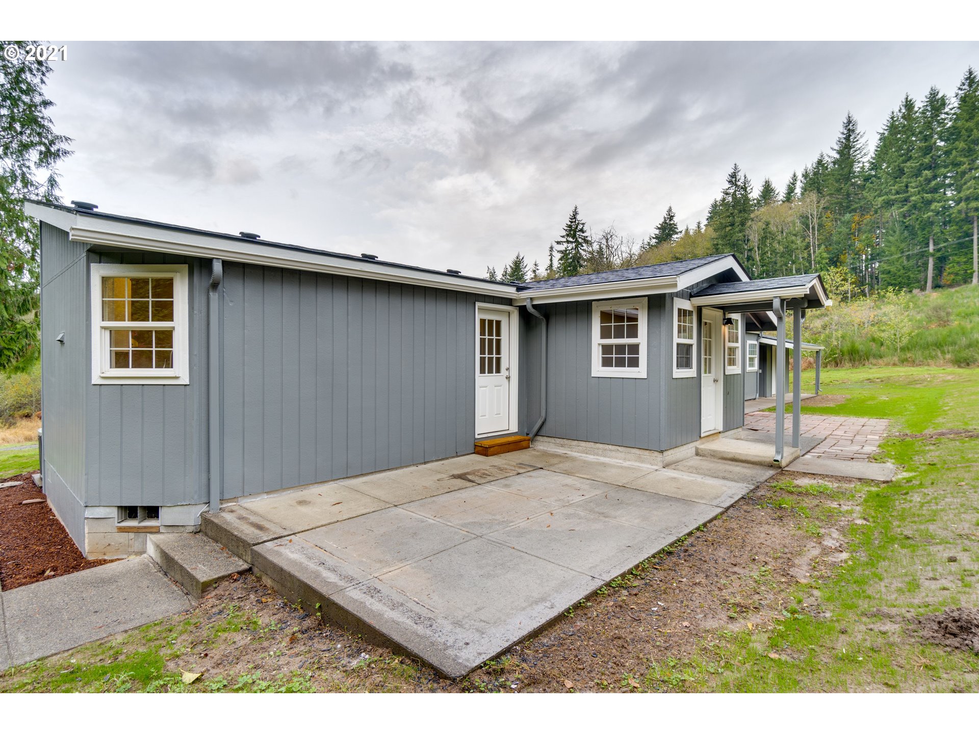26116 Pellham Hill Road Rainier, OR 97048 - Photo 23 of 32 a view of a house with backyard and trees