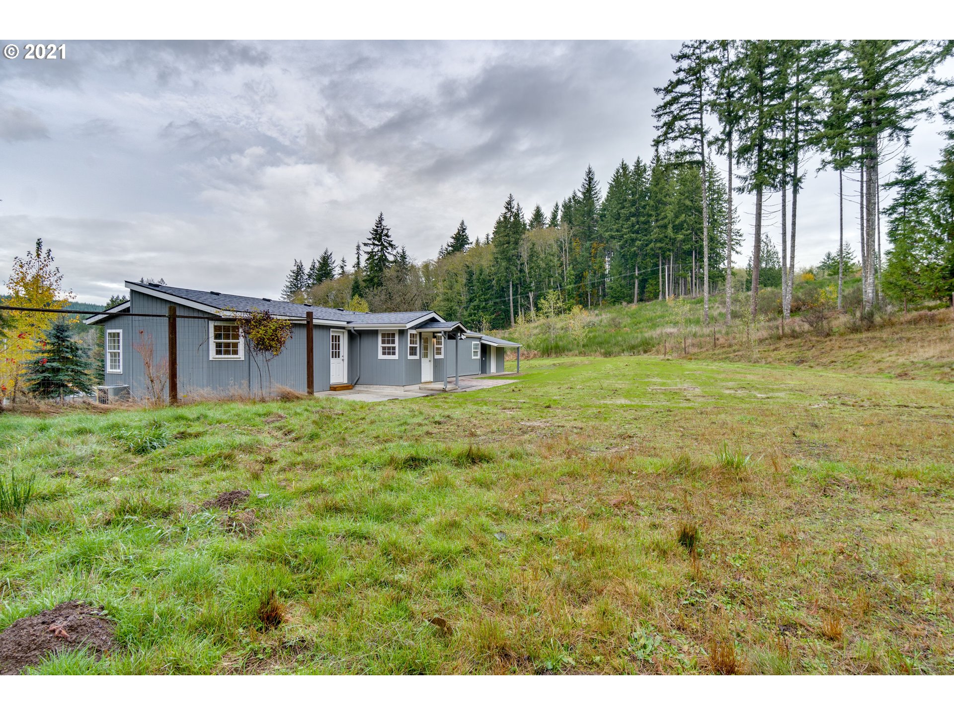 26116 Pellham Hill Road Rainier, OR 97048 - Photo 25 of 32 a view of a house with a backyard