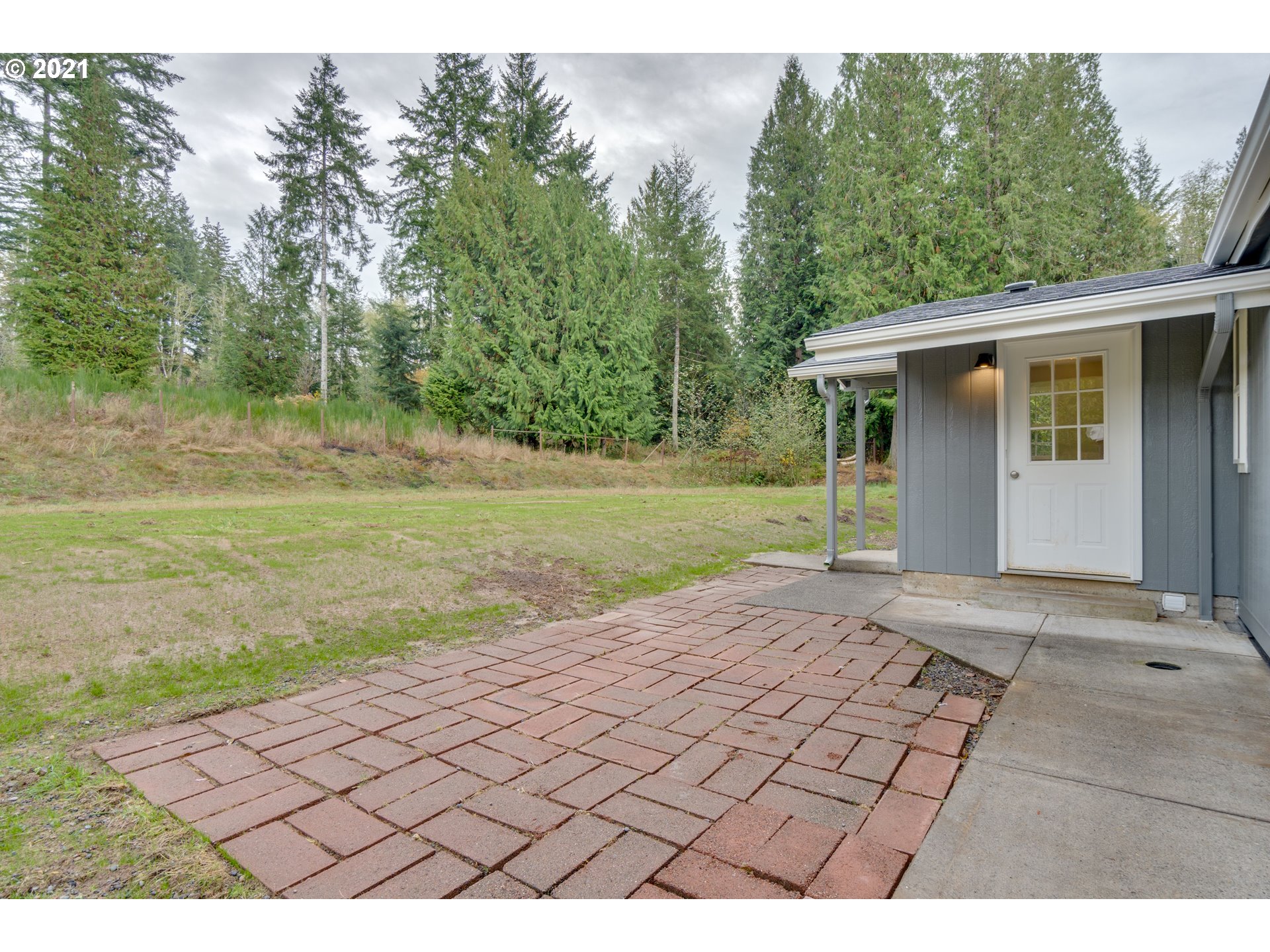 26116 Pellham Hill Road Rainier, OR 97048 - Photo 26 of 32 a view of a backyard with large trees