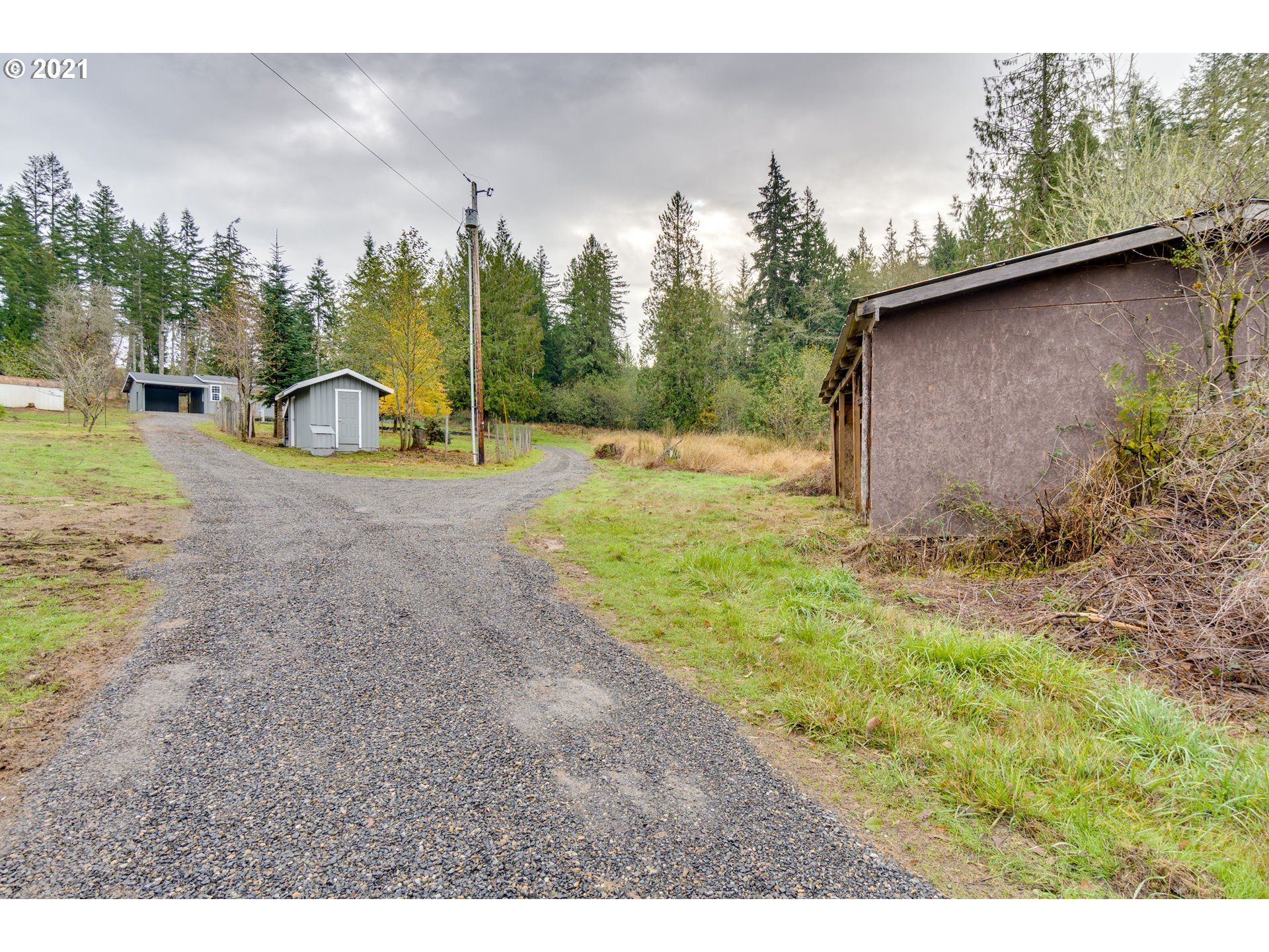 26116 Pellham Hill Road Rainier, OR 97048 - Photo 27 of 32 a view of a backyard with plants and a slide