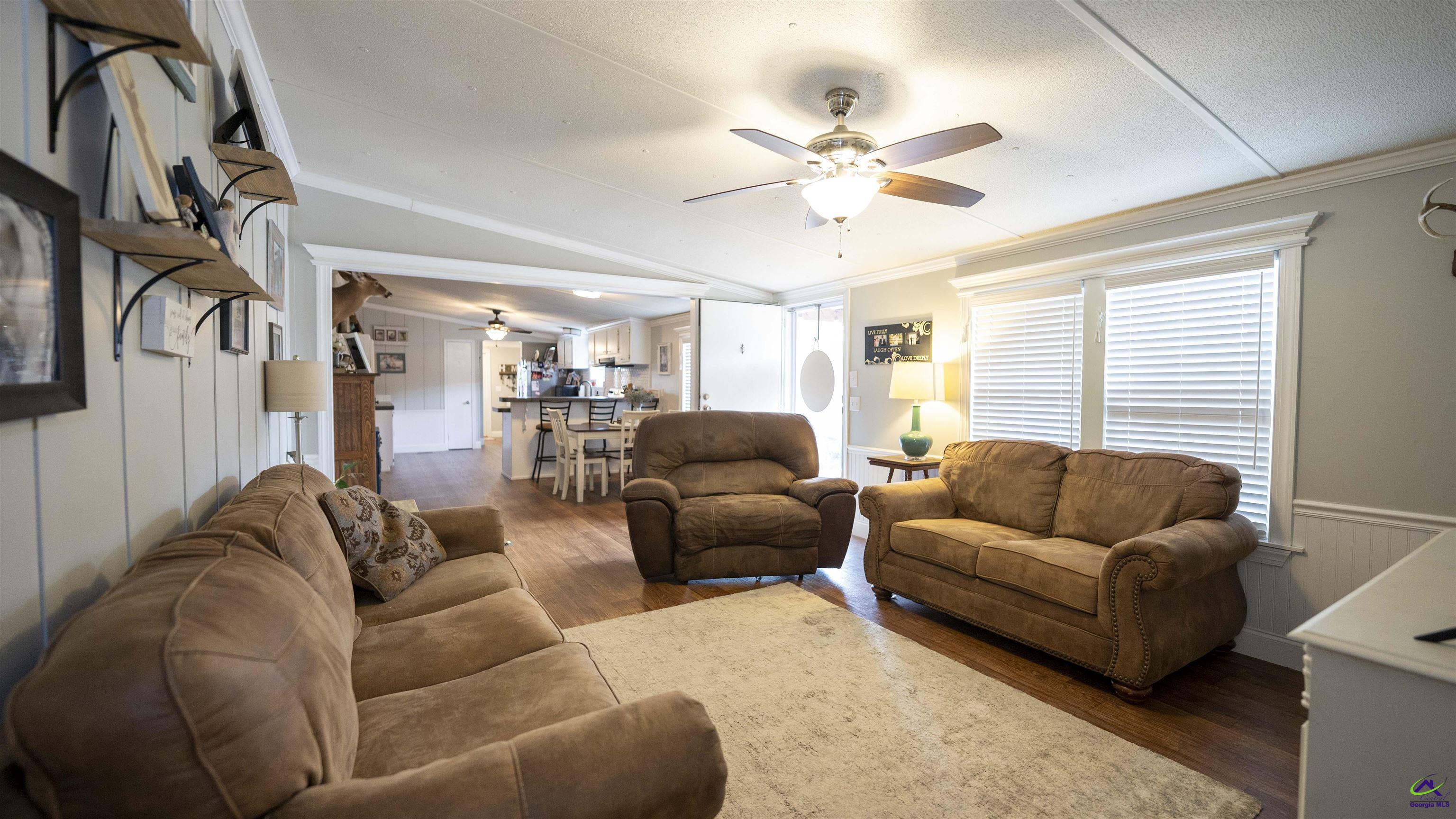 500 Old Milledgeville Road Cochran, GA 31014 - Photo 30 of 48 a living room with furniture and a large window