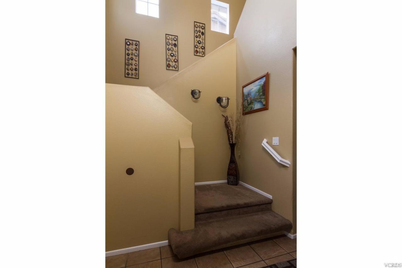 1731 Sonata Drive Oxnard, CA 93030 - Photo 13 of 15 a bathroom with a sink and mirror with toilet