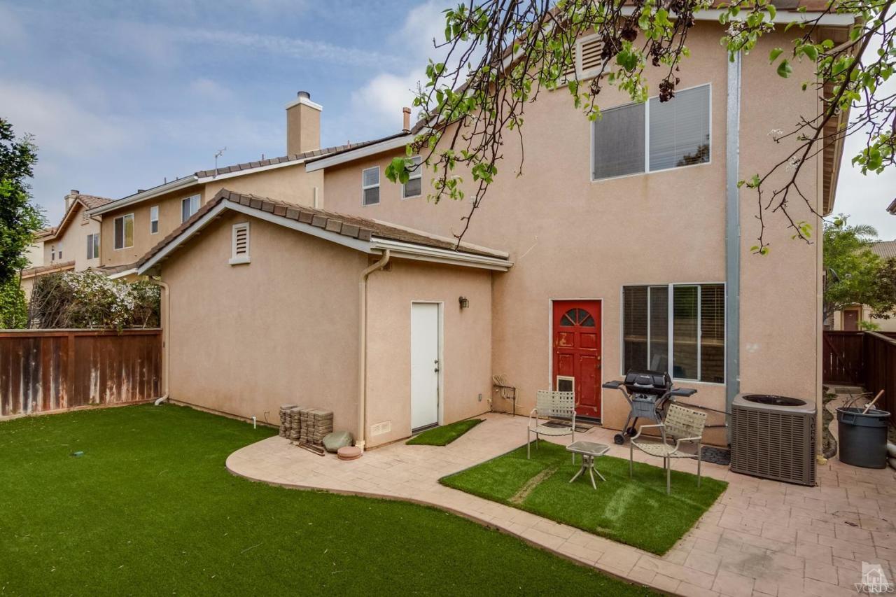 1731 Sonata Drive Oxnard, CA 93030 - Photo 15 of 15 a backyard of a house with table and chairs
