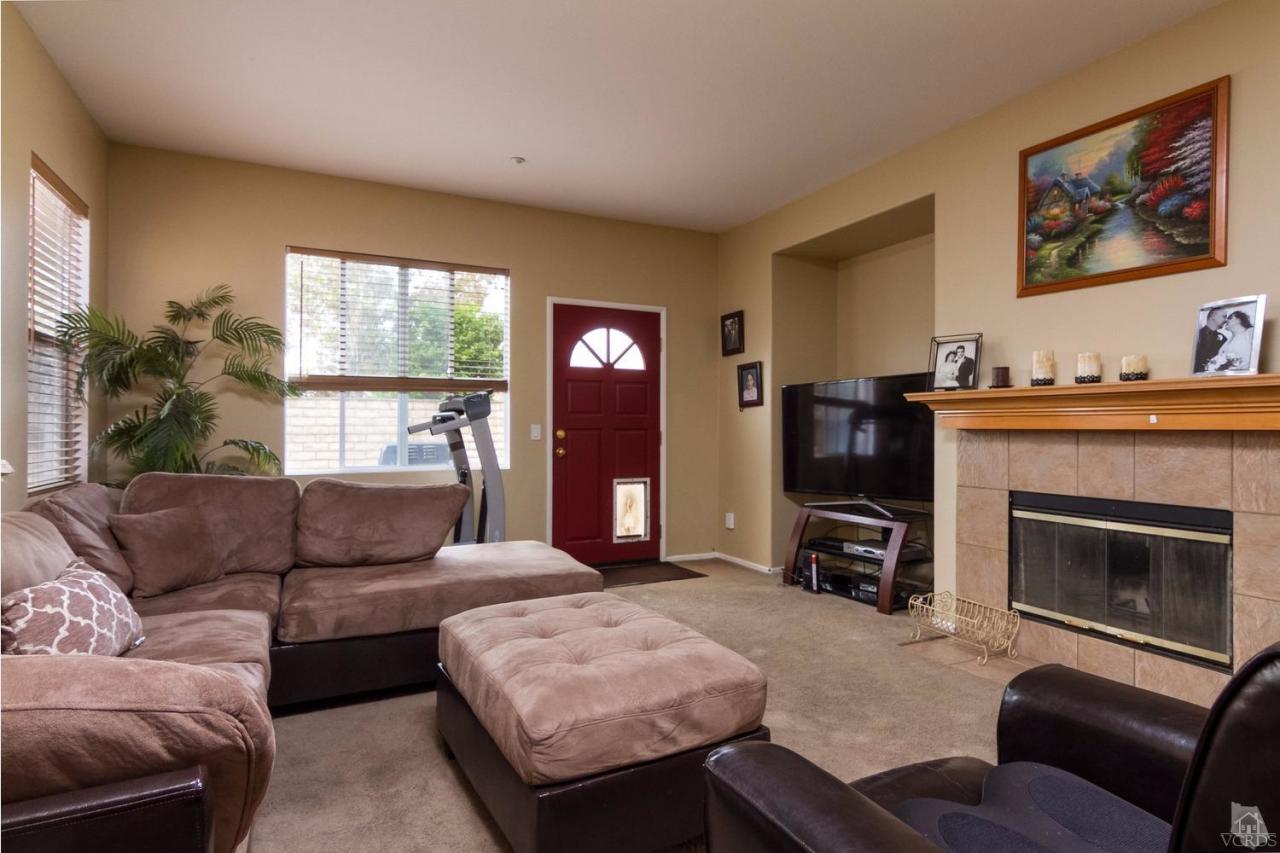 1731 Sonata Drive Oxnard, CA 93030 - Photo 2 of 15 a living room with furniture and a fireplace