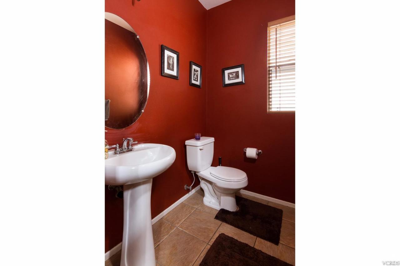 1731 Sonata Drive Oxnard, CA 93030 - Photo 7 of 15 a bathroom with a toilet and a sink