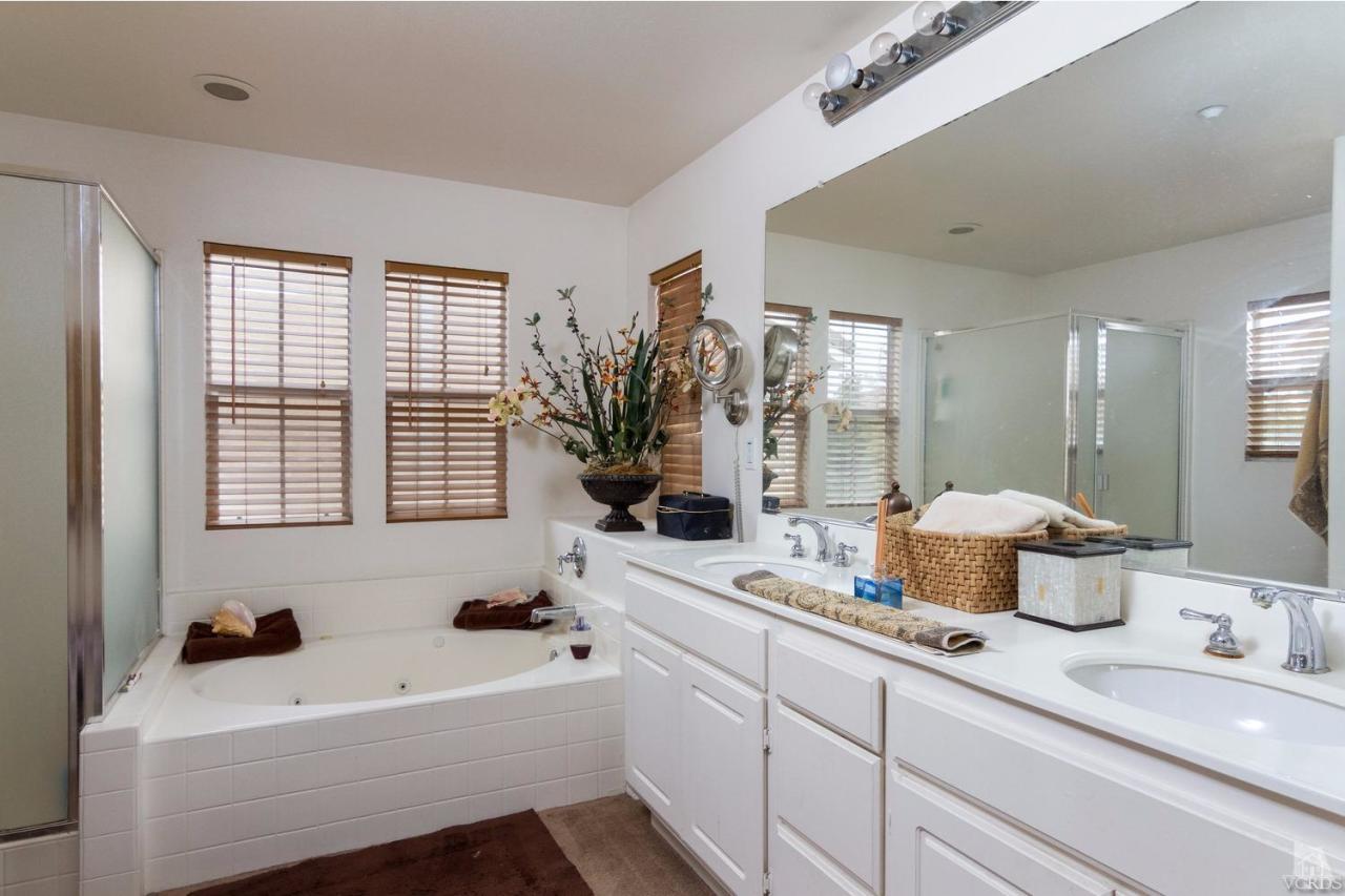 1731 Sonata Drive Oxnard, CA 93030 - Photo 10 of 15 a bathroom with a tub sink and mirror