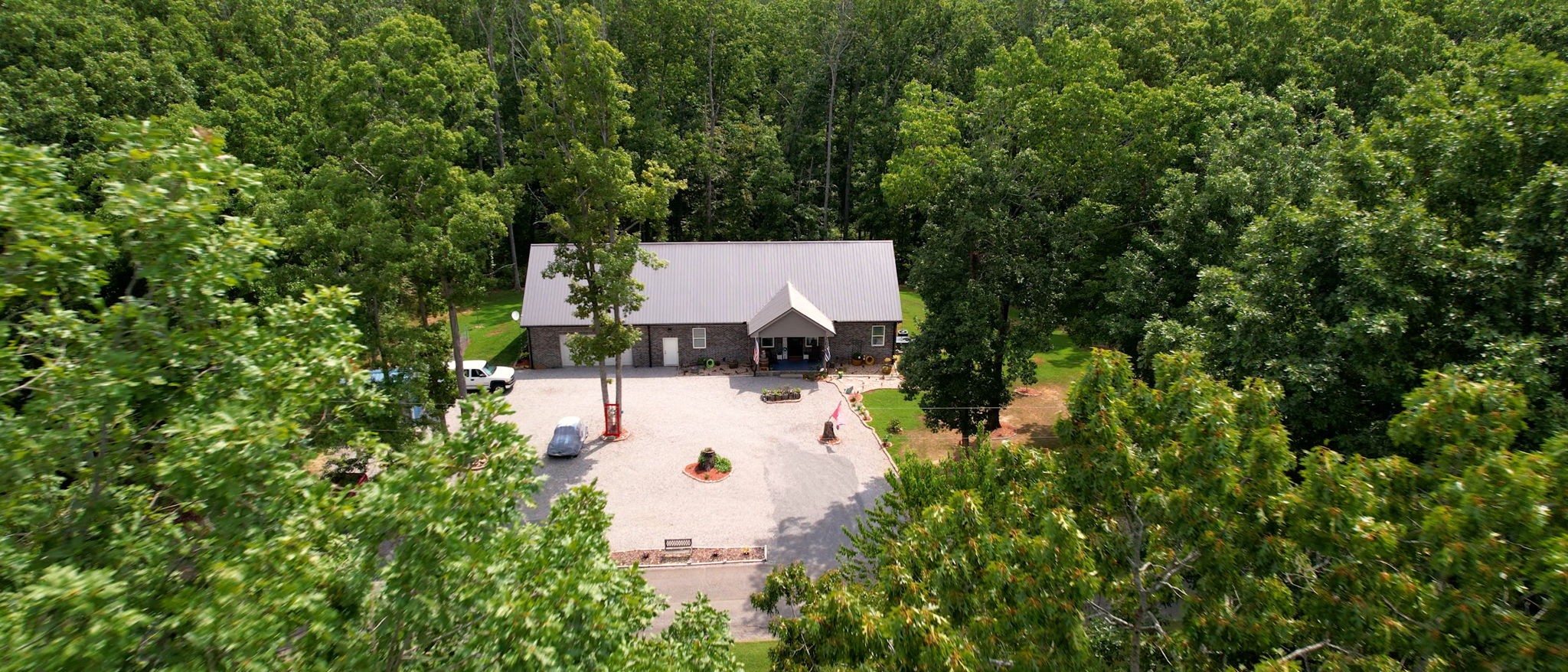 1019 Parker Road Kingston Springs, TN 37082 - Photo 2 of 39 an aerial view of residential house with outdoor space and trees all around