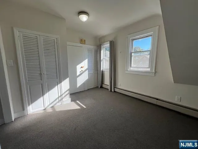a view of empty room with windows