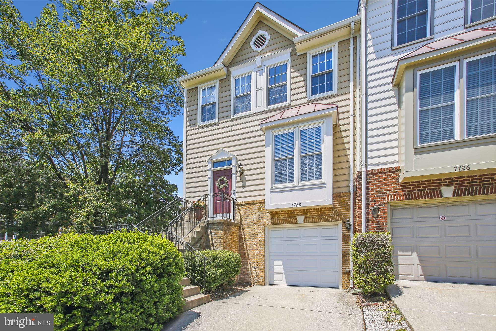 7728 Hickory Glen Way Springfield, VA 22153 - Photo 1 of 35 a front view of a house having yard