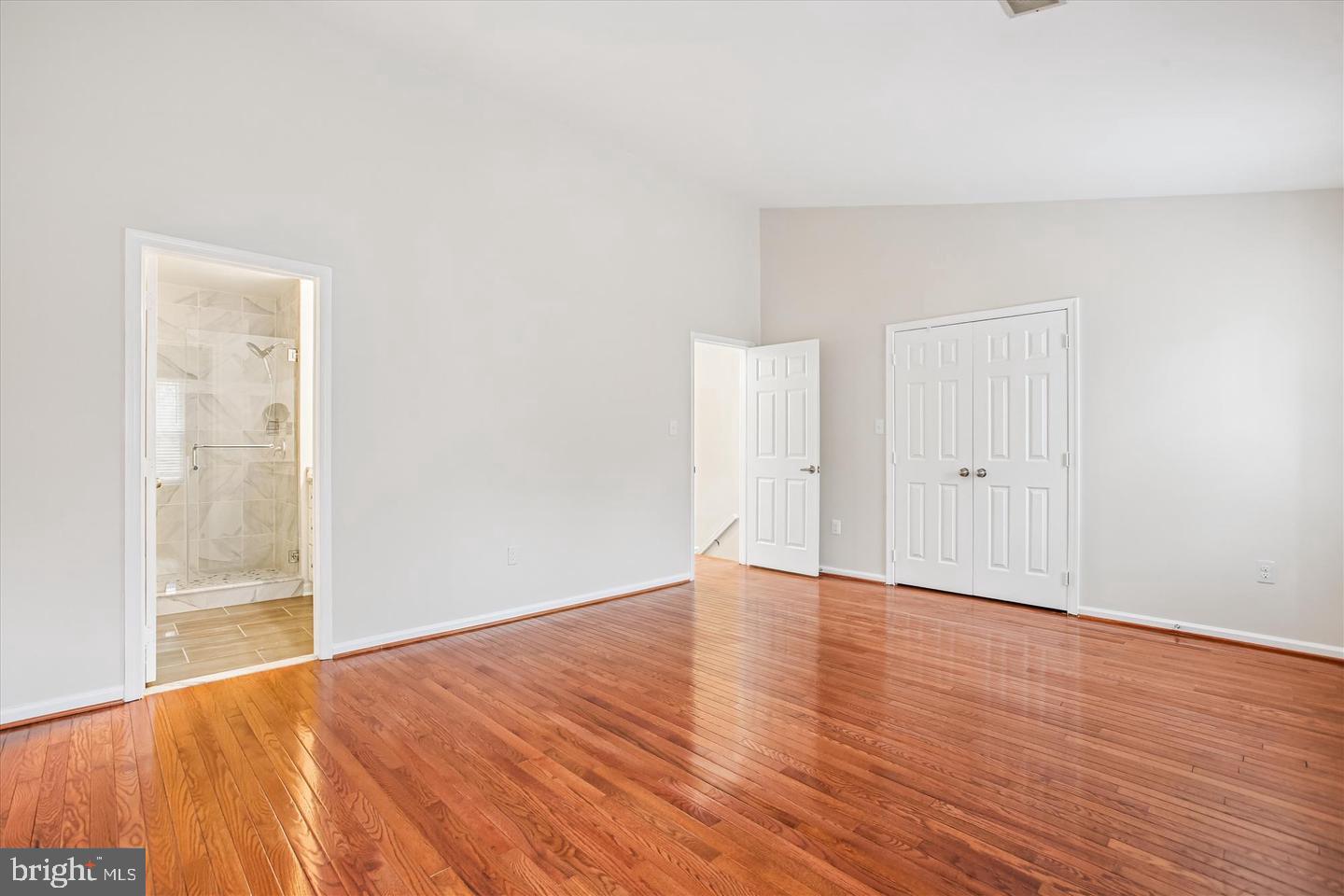 7728 Hickory Glen Way Springfield, VA 22153 - Photo 17 of 35 a view of an empty room with wooden floor