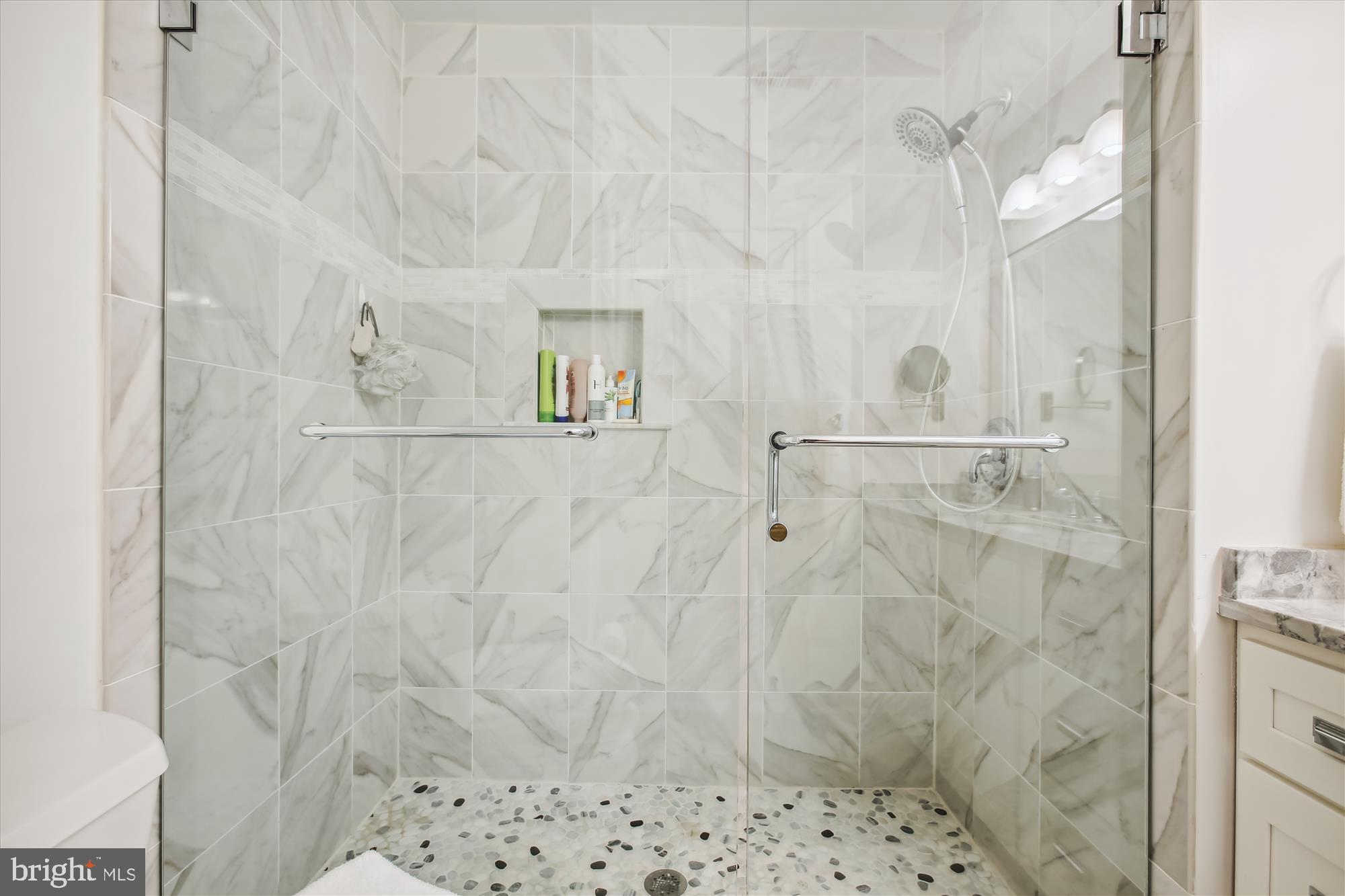 7728 Hickory Glen Way Springfield, VA 22153 - Photo 20 of 35 a bathroom with a shower