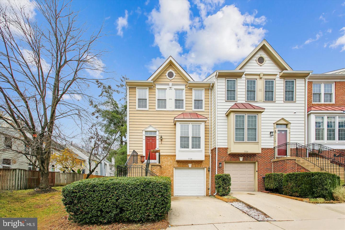 7728 Hickory Glen Way Springfield, VA 22153 - Photo 2 of 35 a front view of a house with a yard