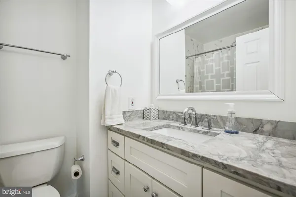 a bathroom with a bathtub and shower