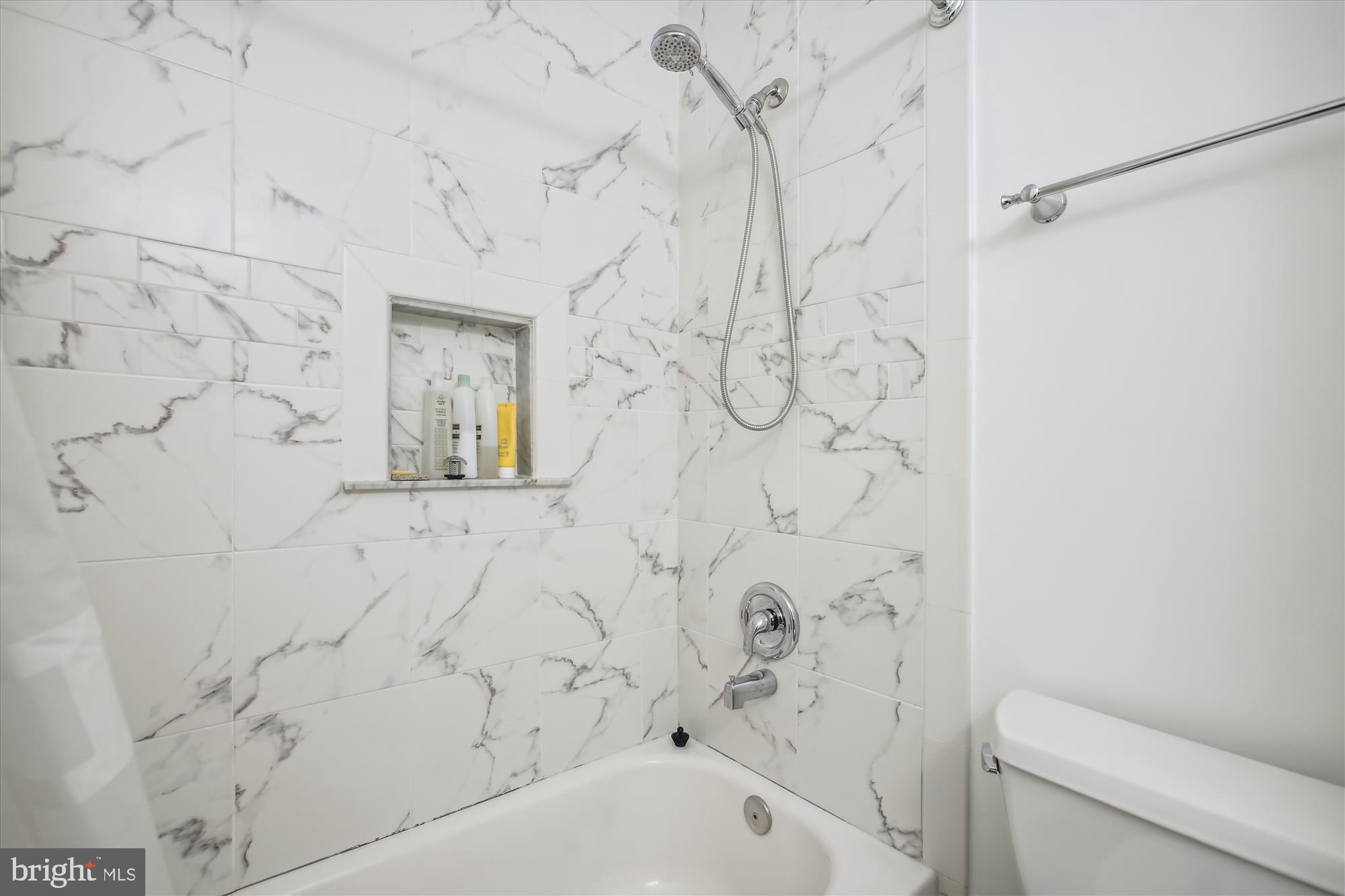 7728 Hickory Glen Way Springfield, VA 22153 - Photo 26 of 35 a bathroom with a bathtub and shower