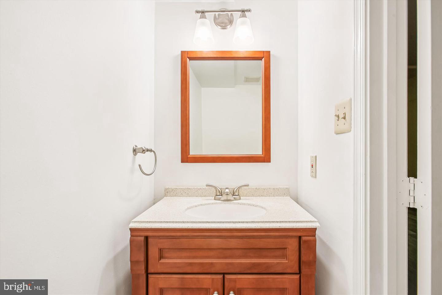 7728 Hickory Glen Way Springfield, VA 22153 - Photo 27 of 35 a bathroom with a sink and a mirror