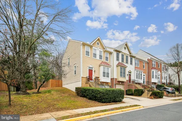a front view of a residential apartment building with a yard