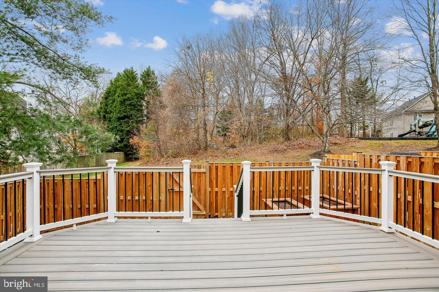 7728 Hickory Glen Way Springfield, VA 22153 - Photo 32 of 35 a view of a balcony with wooden floor and fence