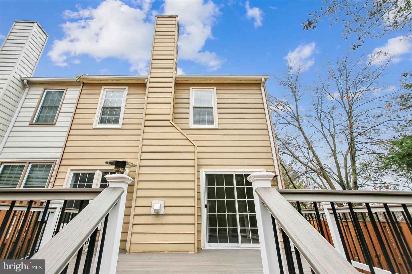 7728 Hickory Glen Way Springfield, VA 22153 - Photo 34 of 35 a view of a balcony with wooden floor and fence