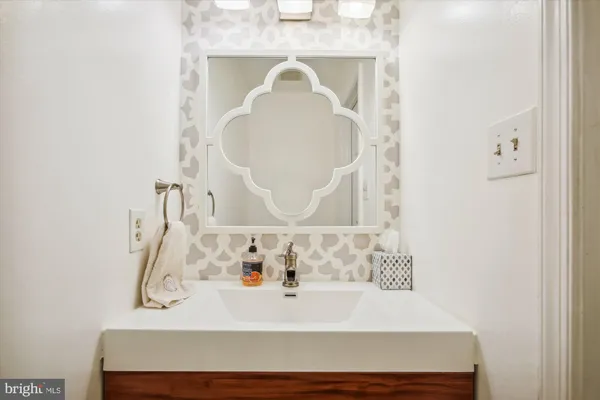 a bathroom with a sink and a mirror