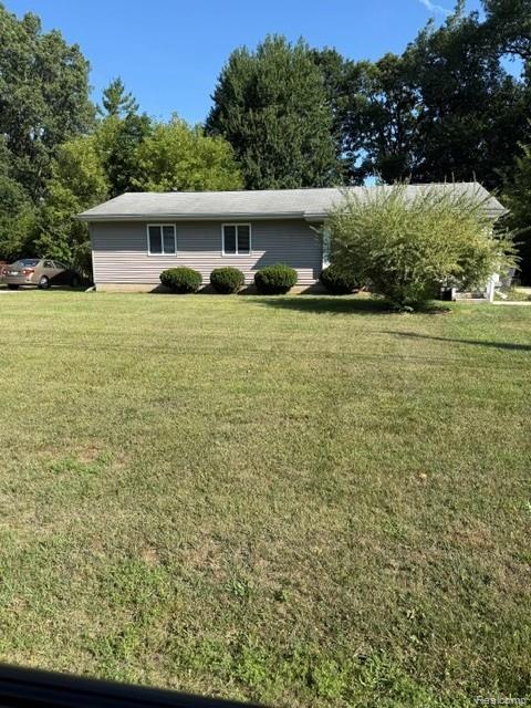 465 Trombley Road Troy, MI 48083 - Photo 24 of 24 Single-story residence featuring gray siding, white-trimmed windows, and a light-colored roof