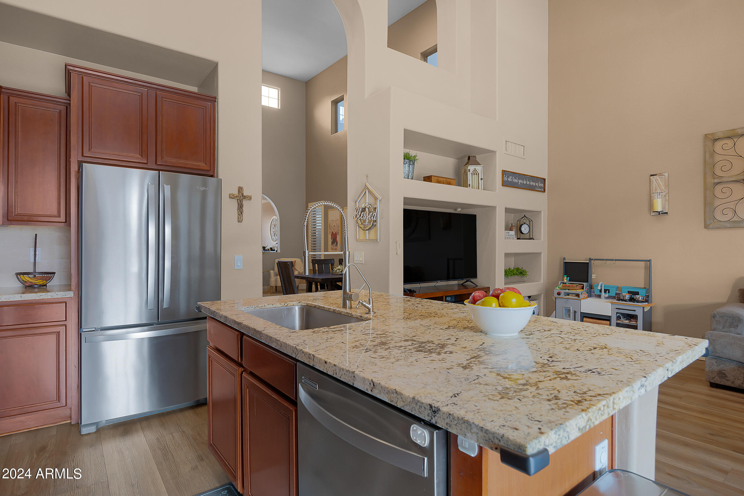 2909 West Silver Fox Way Phoenix, AZ 85045 - Photo 13 of 34 a kitchen with stainless steel appliances granite countertop a sink refrigerator and microwave