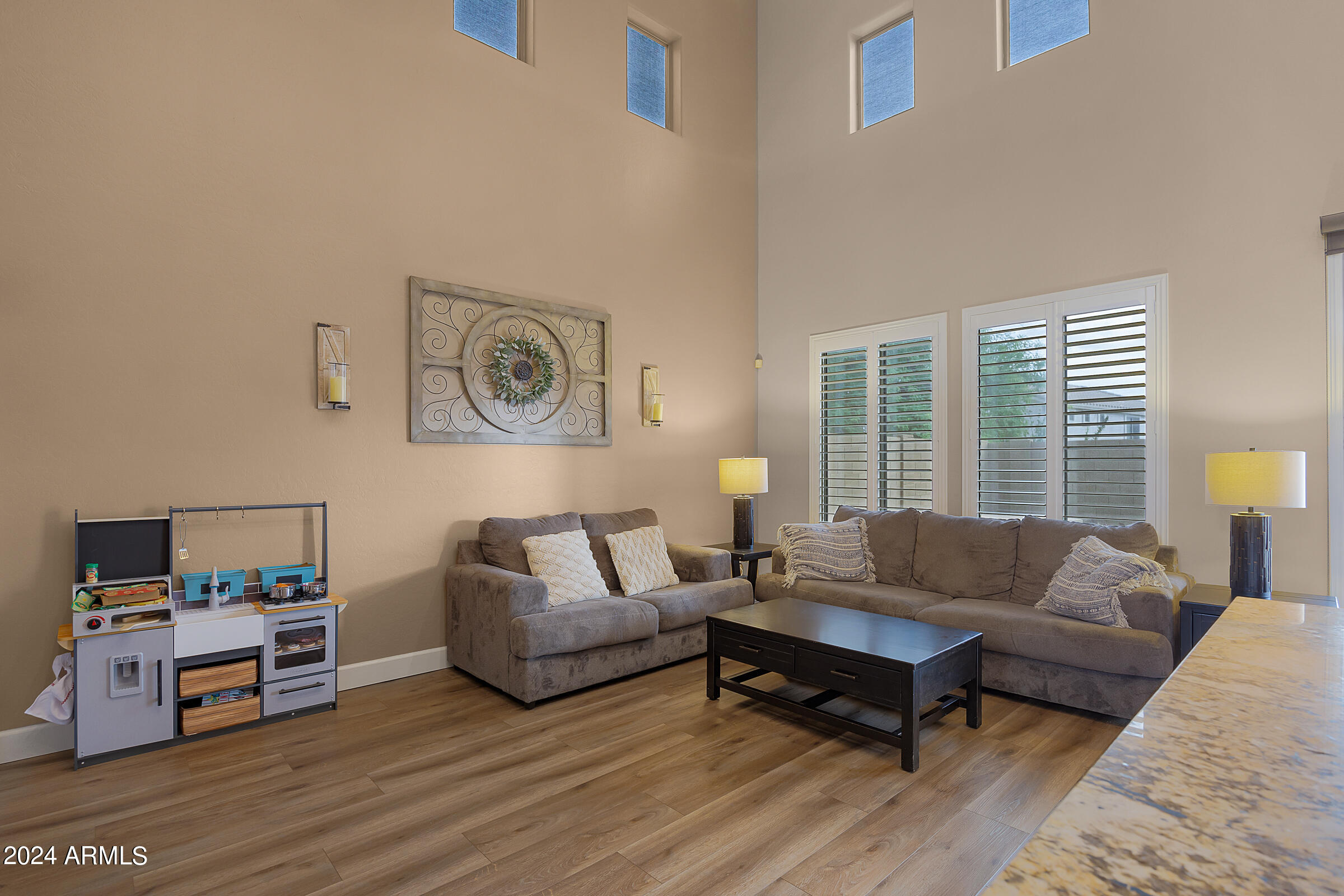 2909 West Silver Fox Way Phoenix, AZ 85045 - Photo 15 of 34 a living room with furniture and a window