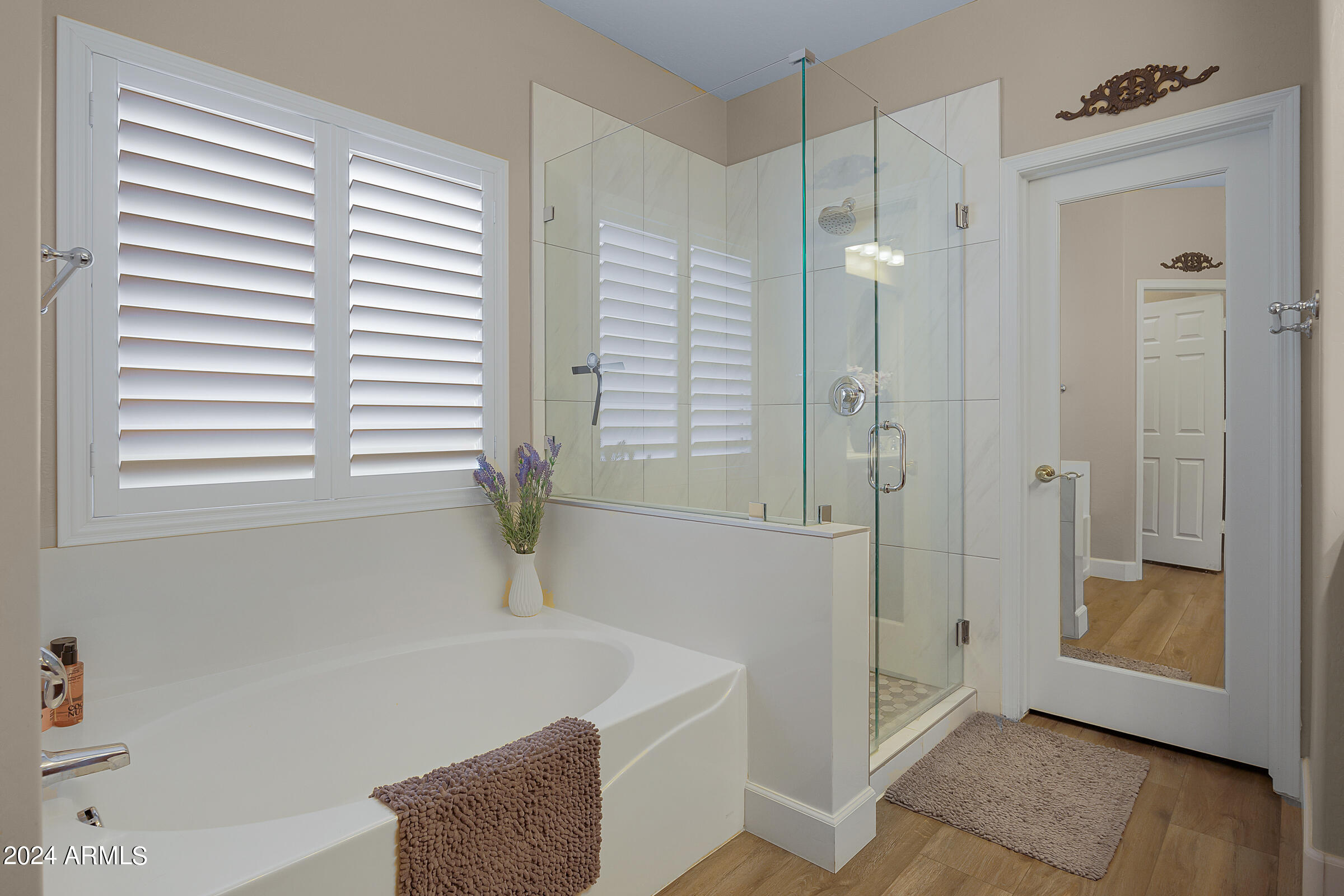 2909 West Silver Fox Way Phoenix, AZ 85045 - Photo 19 of 34 a bathroom with a shower and a bathtub