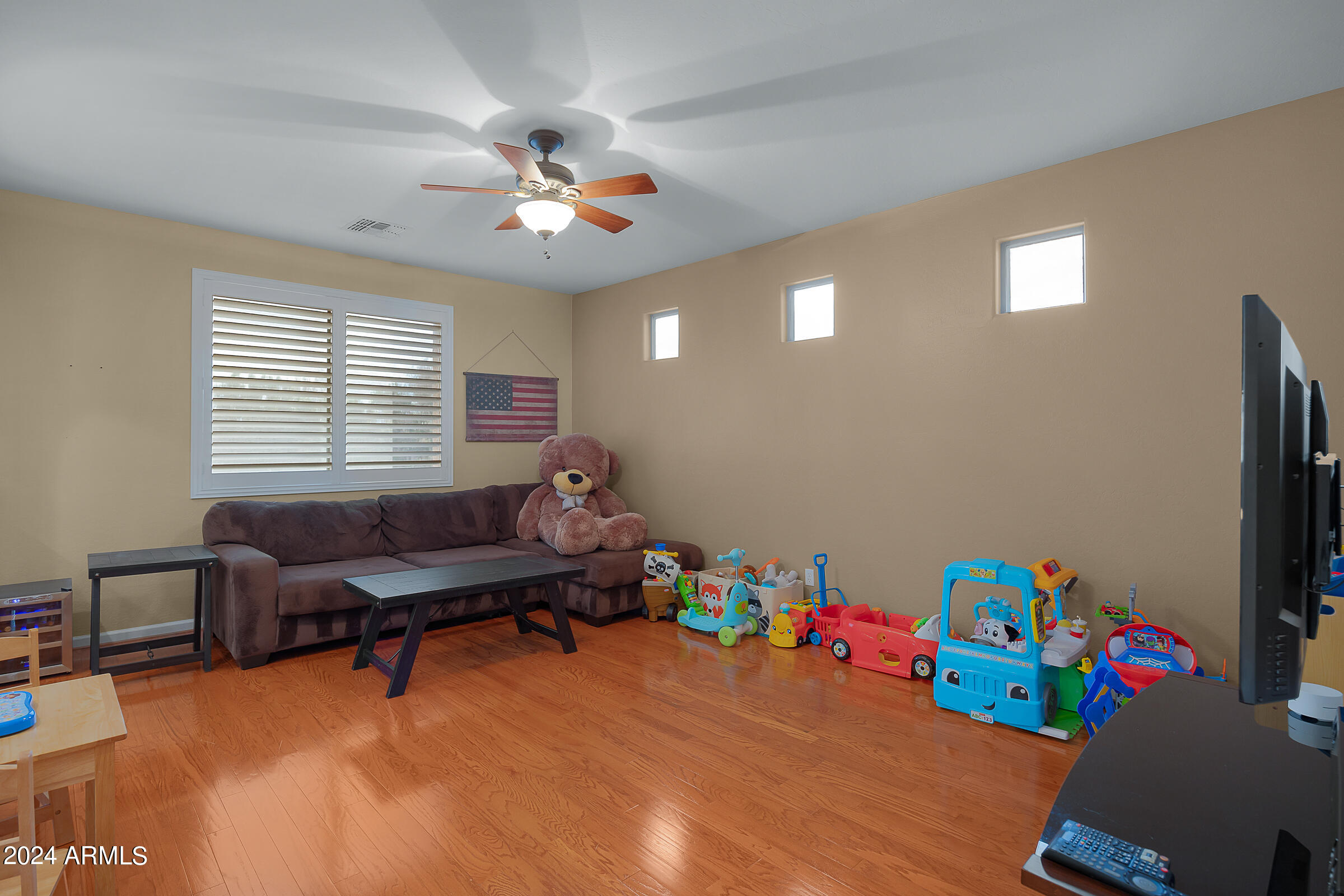 2909 West Silver Fox Way Phoenix, AZ 85045 - Photo 22 of 34 a living room with furniture and a window