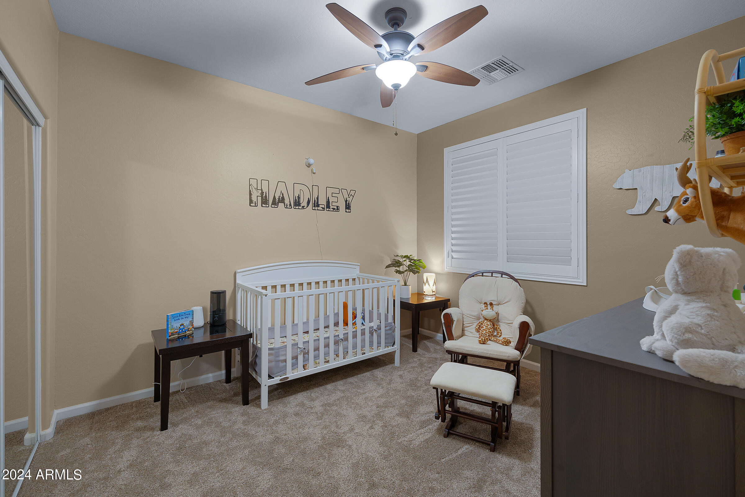 2909 West Silver Fox Way Phoenix, AZ 85045 - Photo 23 of 34 a bedroom with a bed and a window