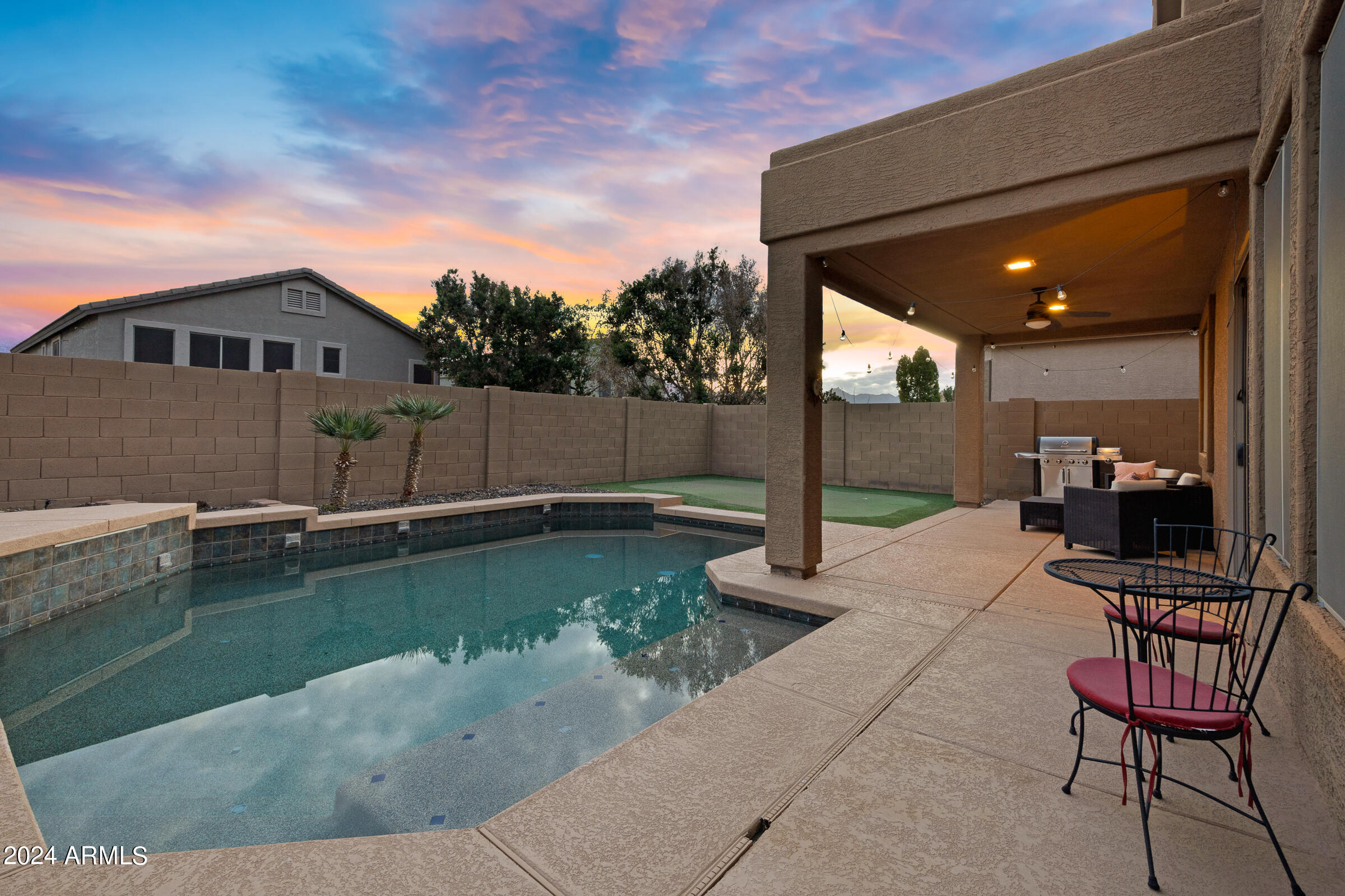2909 West Silver Fox Way Phoenix, AZ 85045 - Photo 33 of 34 a view of a patio with chairs and plants
