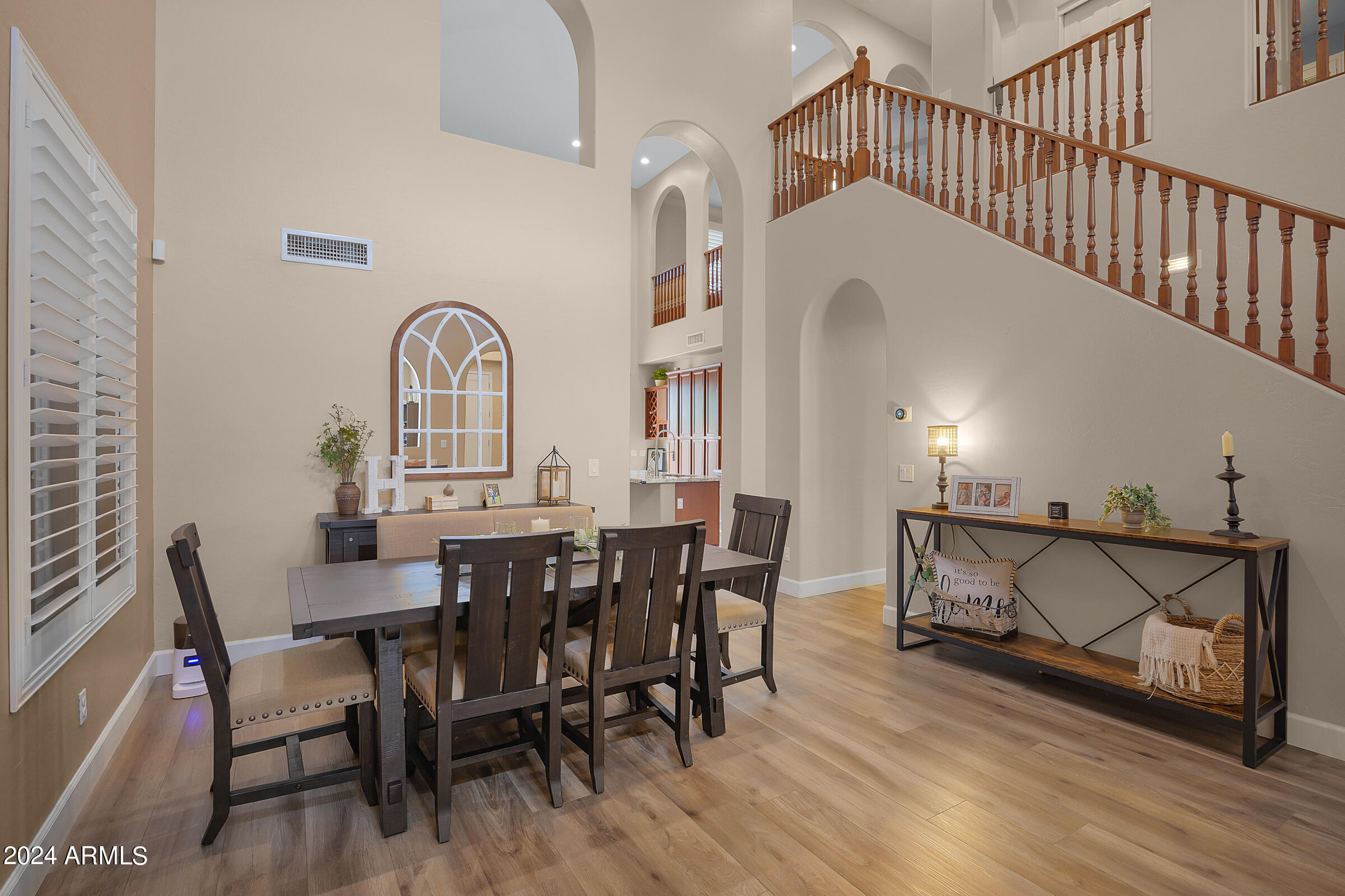 2909 West Silver Fox Way Phoenix, AZ 85045 - Photo 6 of 34 a view of a dining room with furniture and wooden floor