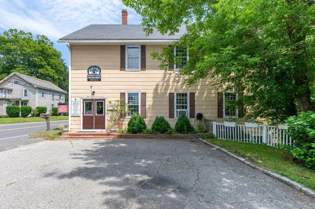 front view of a house with a yard