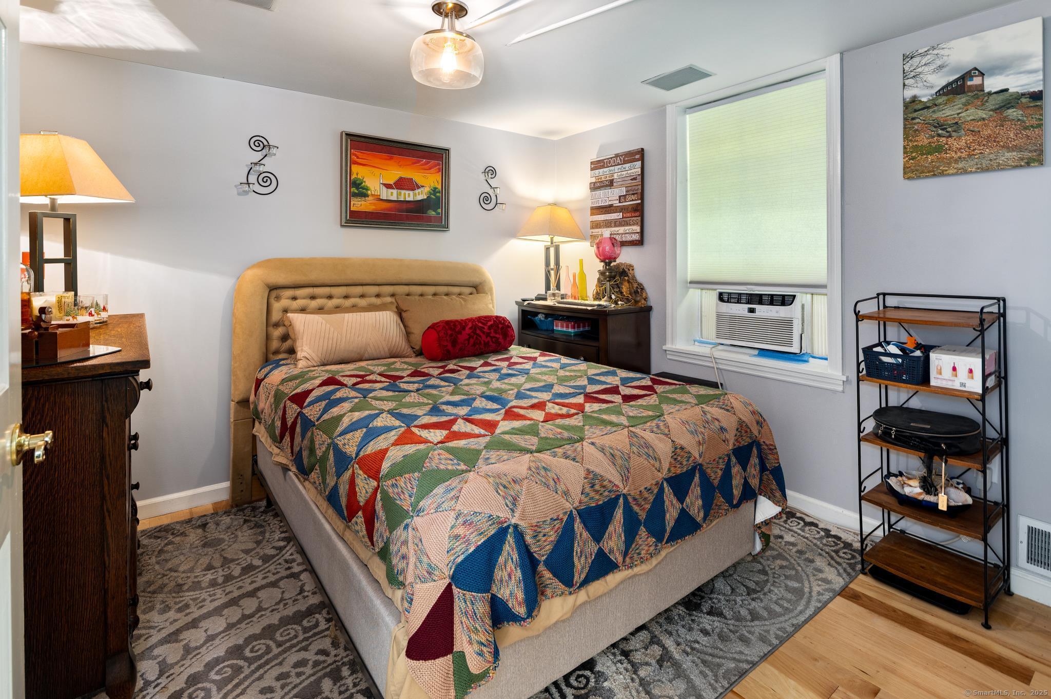 696 Kent Road New Milford, CT 06755 - Photo 12 of 28 a bedroom with bed and a lamp on dresser