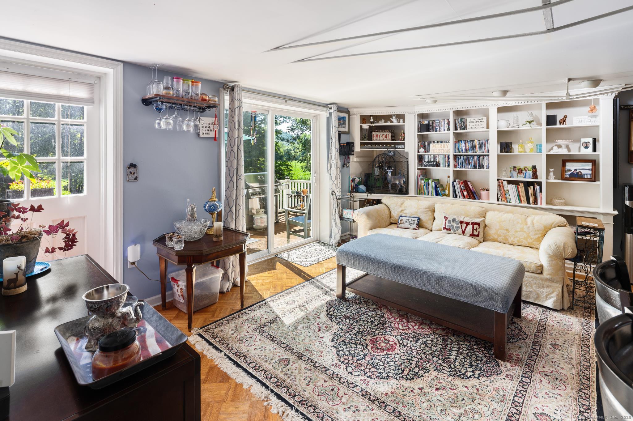 696 Kent Road New Milford, CT 06755 - Photo 13 of 28 a living room with furniture and a floor to ceiling window and a flat screen tv