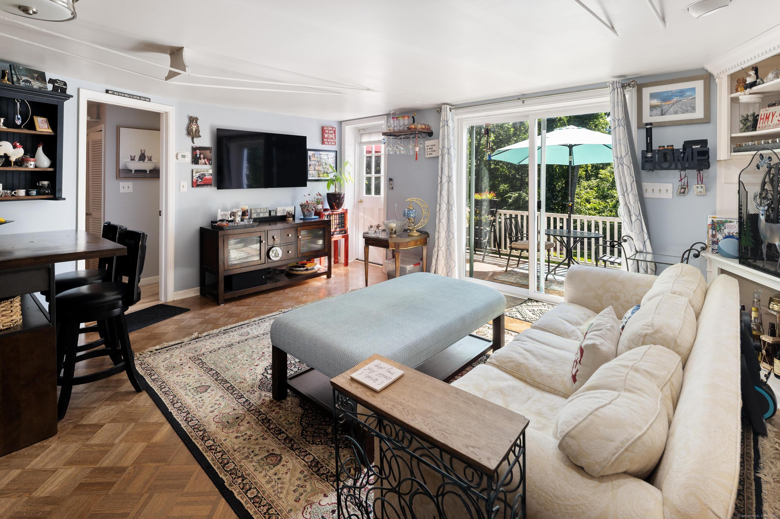 696 Kent Road New Milford, CT 06755 - Photo 14 of 28 a living room with furniture a flat screen tv and a fireplace