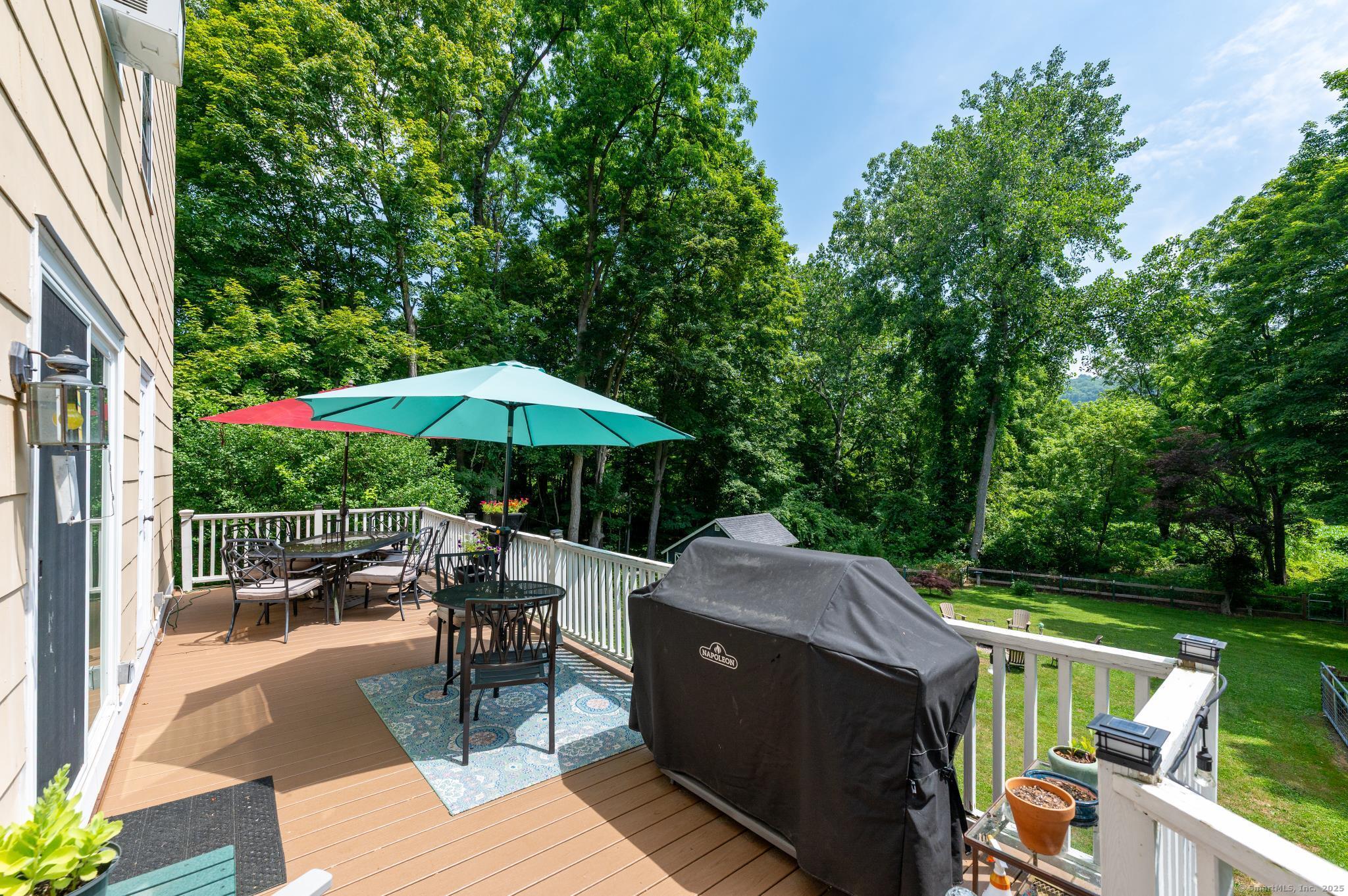 696 Kent Road New Milford, CT 06755 - Photo 23 of 28 an outdoor space with furniture and umbrella