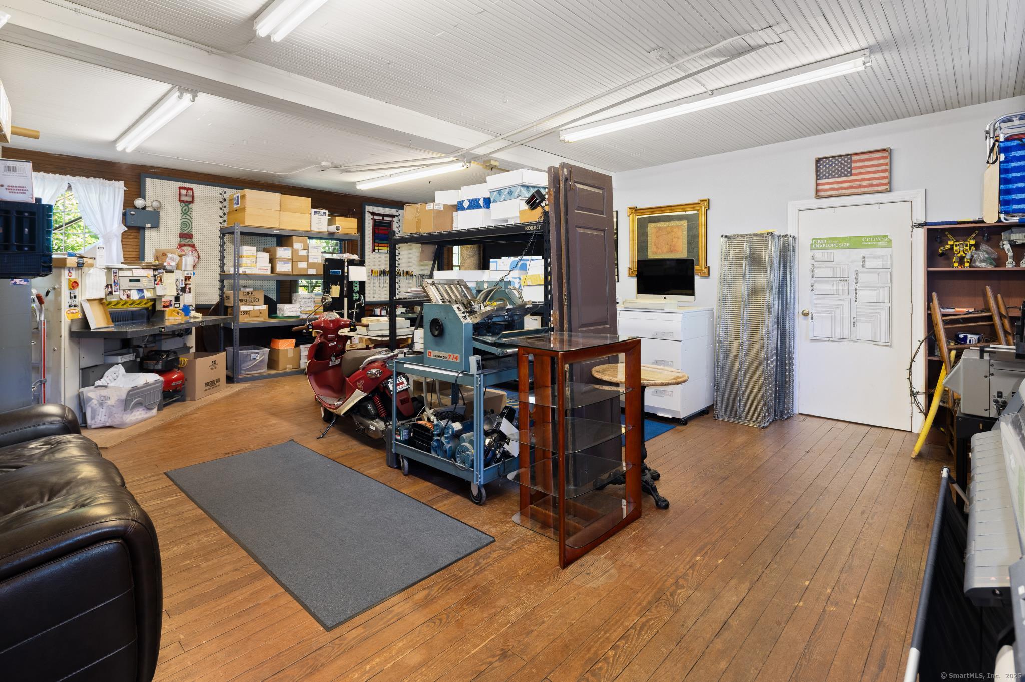 696 Kent Road New Milford, CT 06755 - Photo 5 of 28 a living room with lots of furniture and a large window