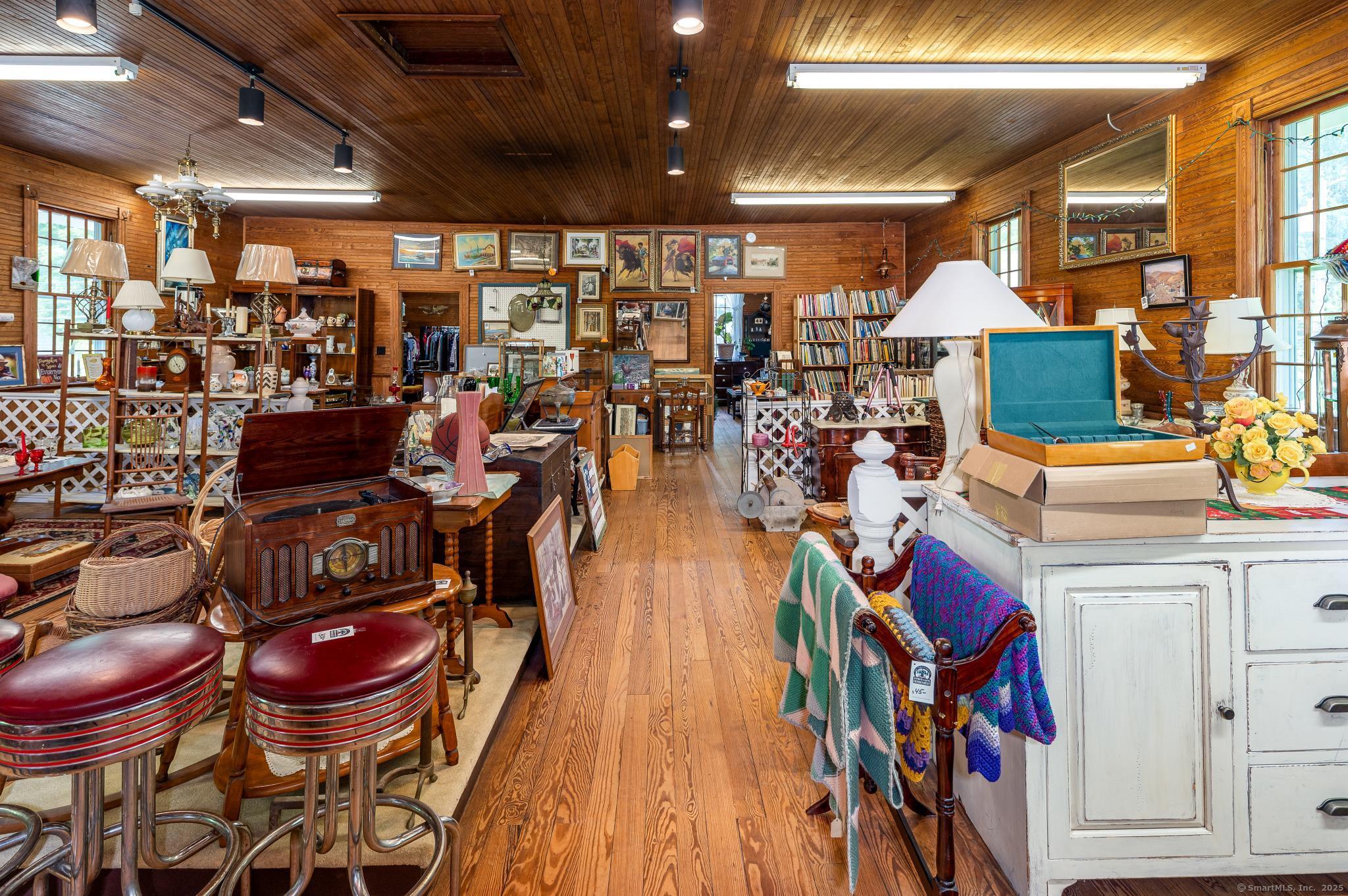 696 Kent Road New Milford, CT 06755 - Photo 6 of 28 a group of people sitting in a room