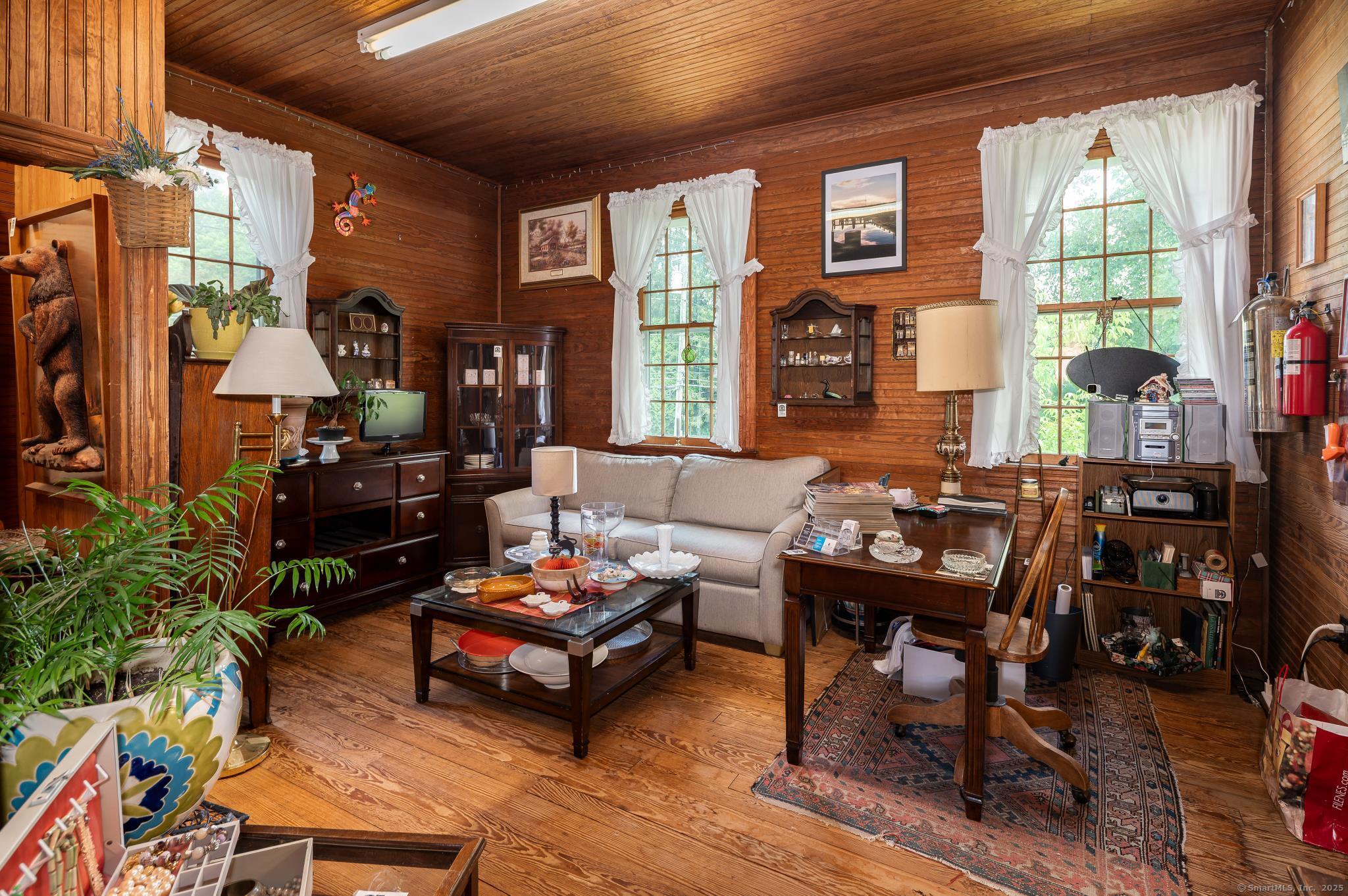 696 Kent Road New Milford, CT 06755 - Photo 8 of 28 a living room with furniture and a floor to ceiling window