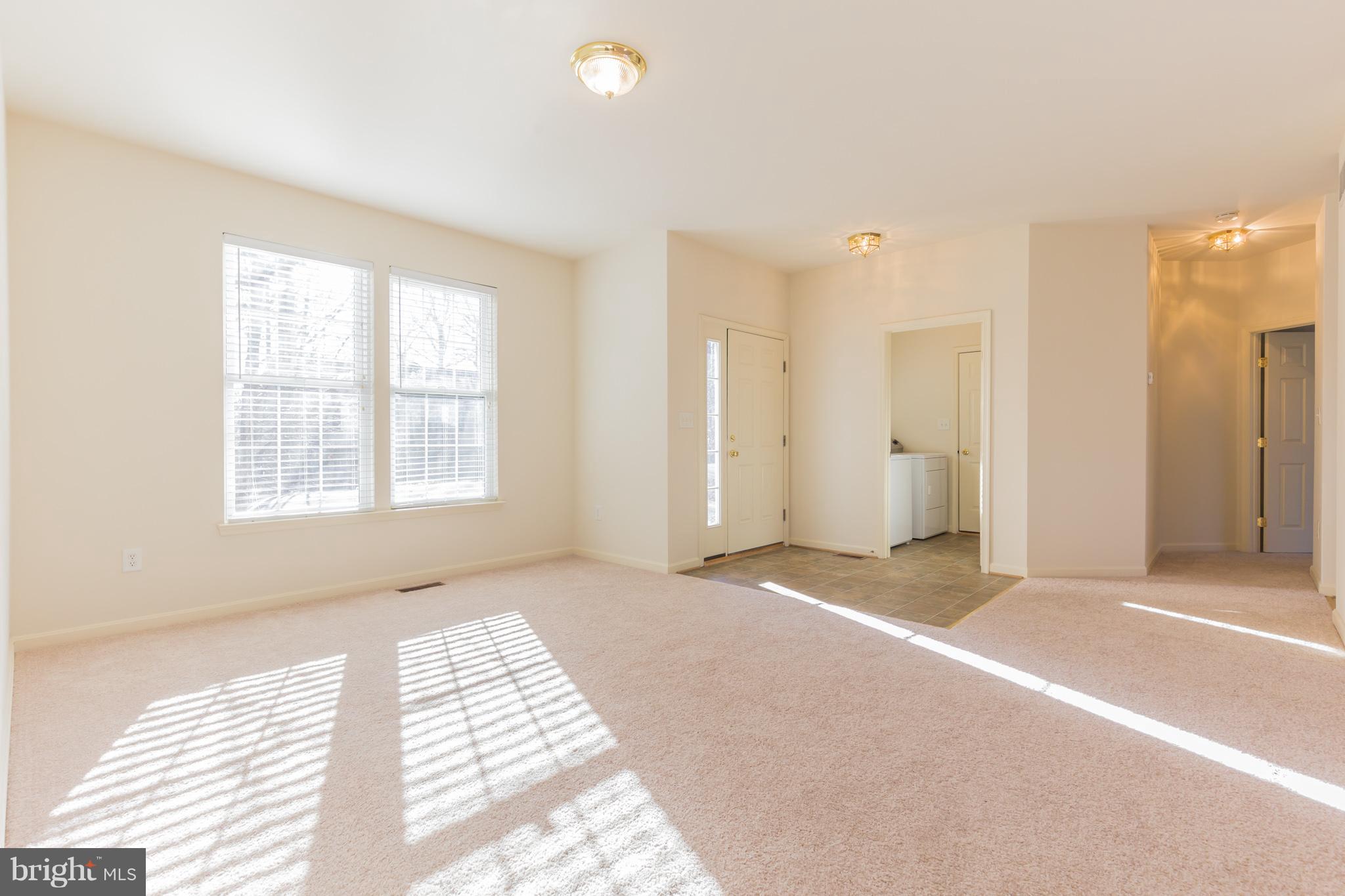 11155 Rawhide Road Lusby, MD 20657 - Photo 10 of 30 Living room and foyer area with hall and laundry