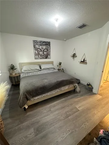 a bedroom with a bed and furniture