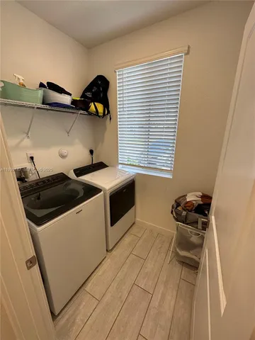 a utility room with washer and dryer
