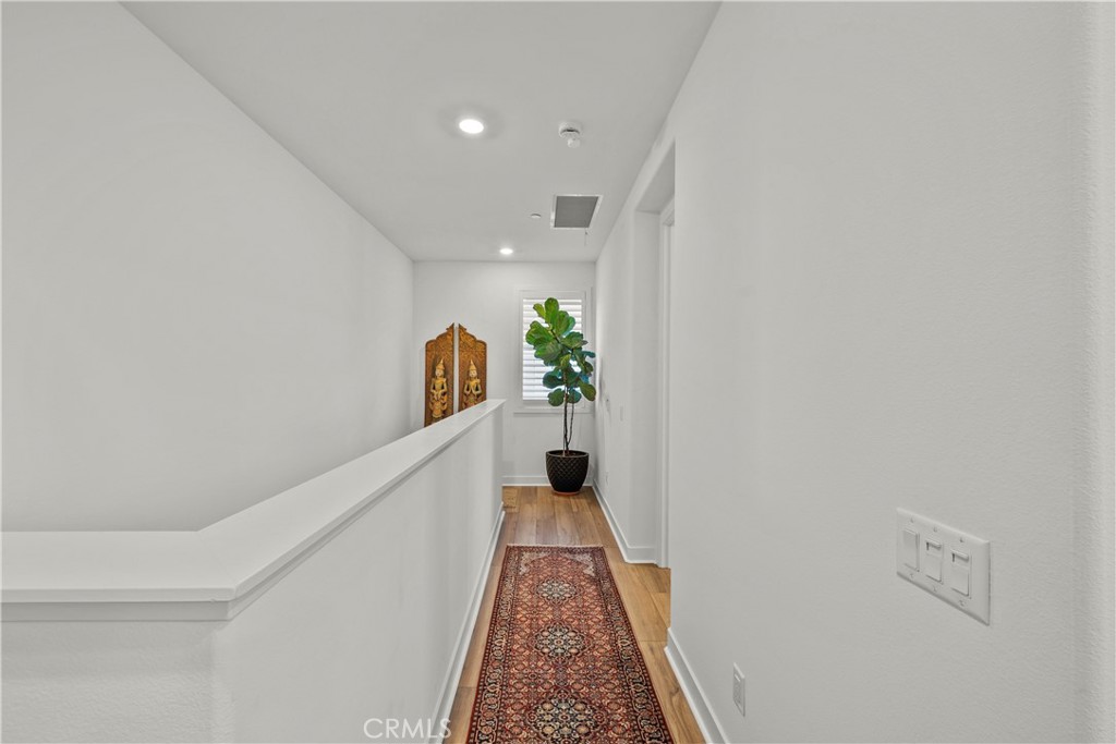 1663 Rosewell Road West Covina, CA 91791 - Photo 24 of 45 a view of a hallway with wooden floor and stairs